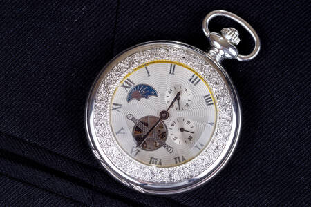 Pocket watch on black background