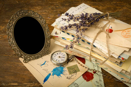 Pocket watch, photo frame and letters