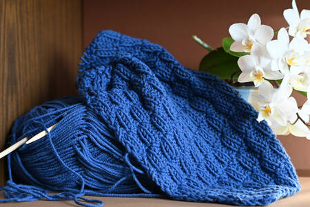 Blue yarn and flowers