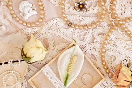 Wedding rings and pearl beads