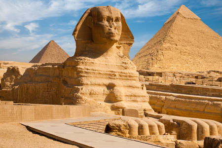Great Sphinx on the background of the pyramids