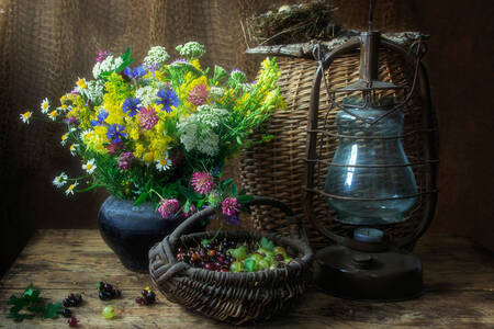 Wildflowers and berries in a basket