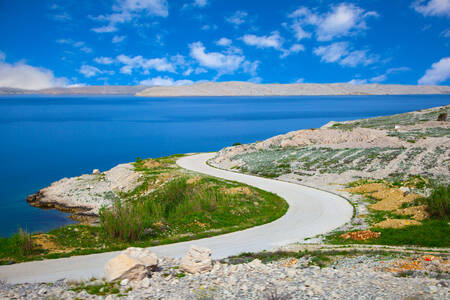 Road through the rocky beach