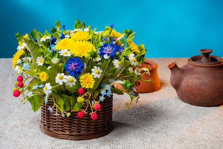 Bouquet of wild flowers in a basket
