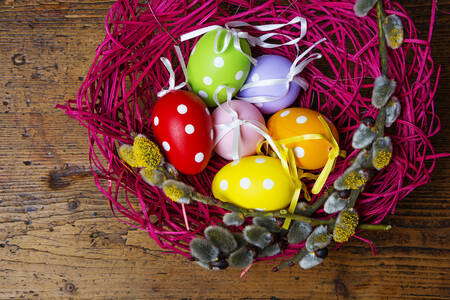 Easter eggs in a pink nest