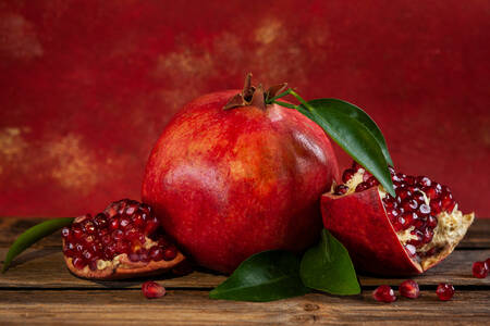 Pomegranate on a red background