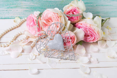 Heart and roses on a white table