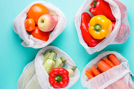 Vegetables and fruits in cotton bags