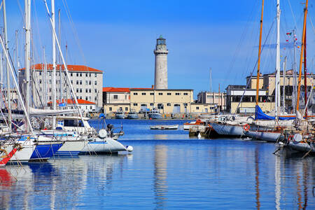 Yachts and lighthouse in Trieste