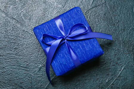 Blue gift box with a bow