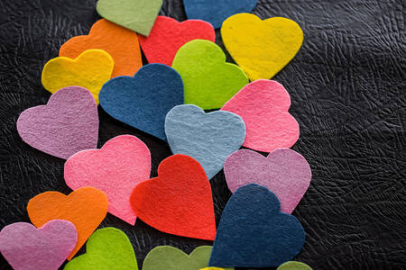 Multi-colored hearts on a dark background