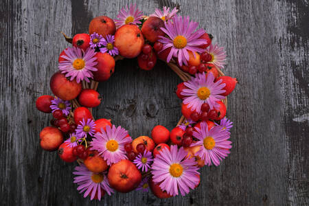 Wreath of autumn flowers and apples