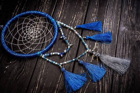 Dreamcatcher on wooden background