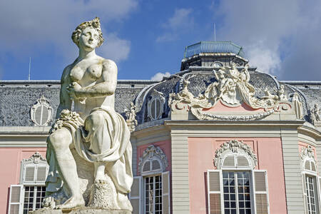Sculpture against the backdrop of the facade of Benrath Palace
