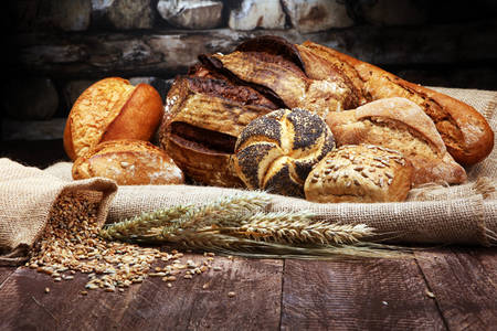 Bread and buns on a wooden table