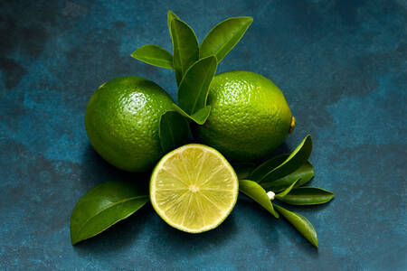 Limes on a blue background