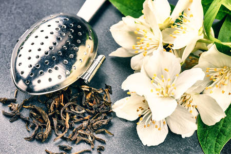 Tea leaves and jasmine flowers