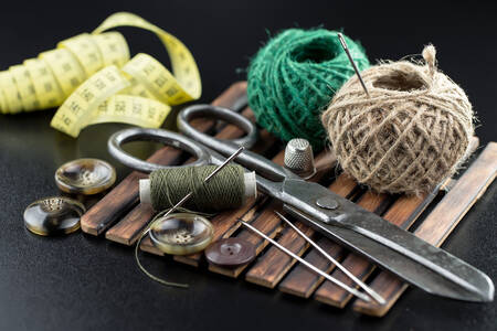 Threads, needles and sewing scissors