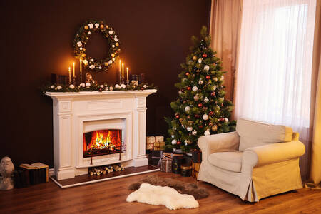 Living room with fireplace, Christmas tree and candles