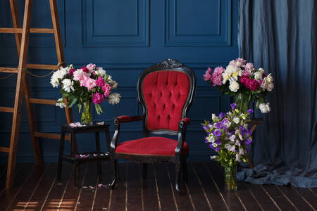 Armchair and vase with flowers