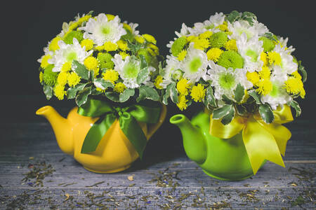 Flowers in ceramic teapots