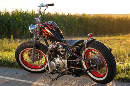 Custom bobber motorbike standing on a road