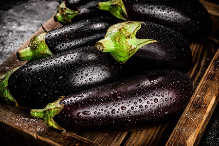 Eggplants on a wooden tray