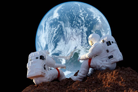 Astronauts on the background of the planet
