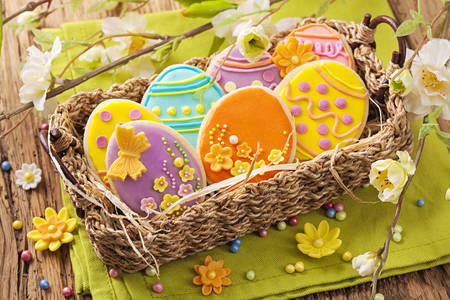 Colorful easter cookies in a basket
