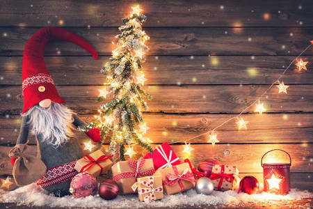 Weihnachtsmann umgeben von Geschenken