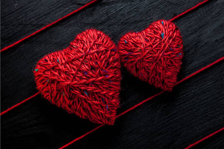 Hearts made of red threads