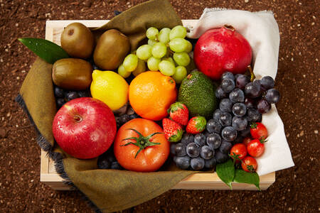 Berries and fruits in a wooden box