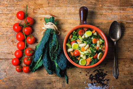 Tuscan soup and tomatoes on the table