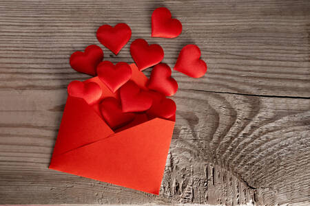 Envelope with red hearts