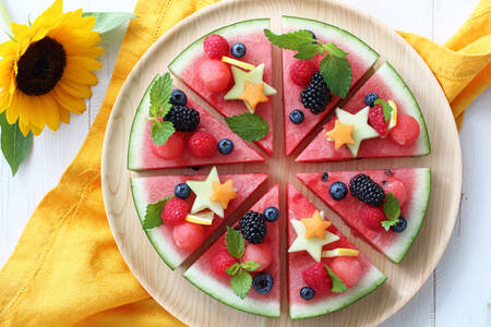 Watermelon slices with different berries