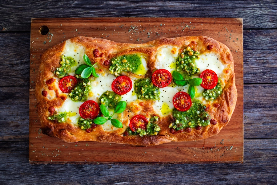 Pizza with mozzarella cheese and pesto