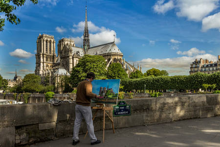 Umelec maľuje katedrálu Notre Dame