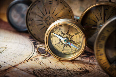 Old compasses on the map