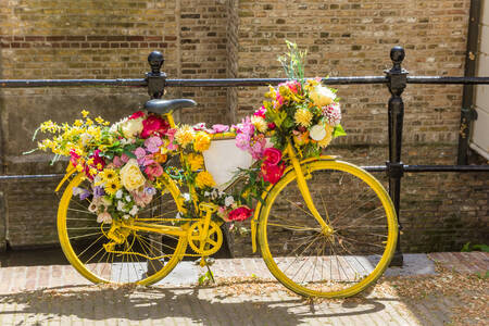 Yellow bicycle with flowers