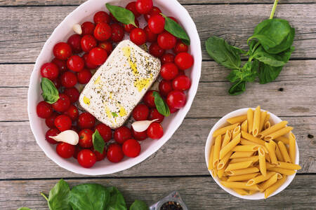Ingredients for baked pasta with feta and tomatoes