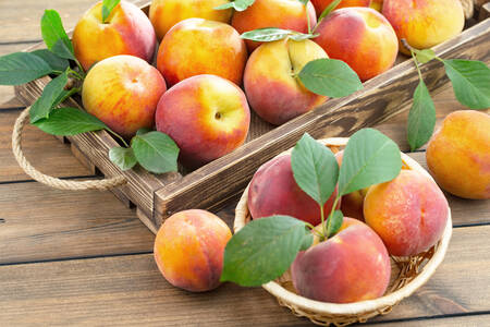 Peaches in a wooden crate