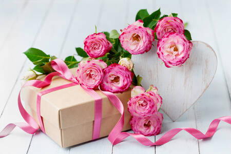 Gift, flowers and wooden heart