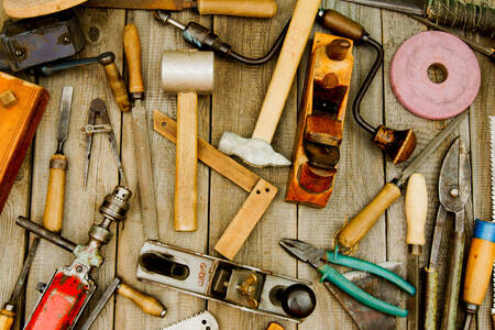 Working tools on wooden background