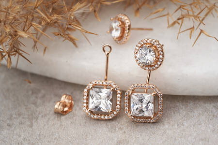 Gold earrings with white crystals