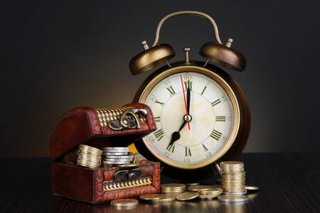 Vintage clock and coins