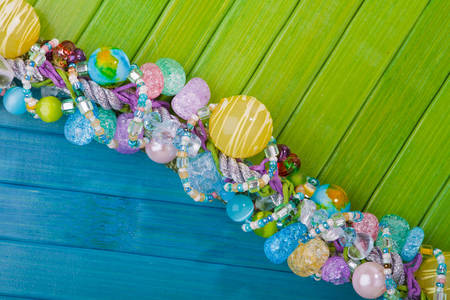 Multicolored beads on a bright background