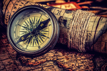 Compass on an ancient world map