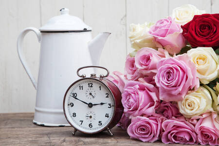 Old alarm clock and roses