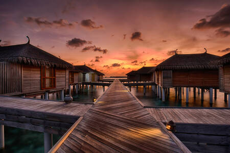 Sunset over water villas