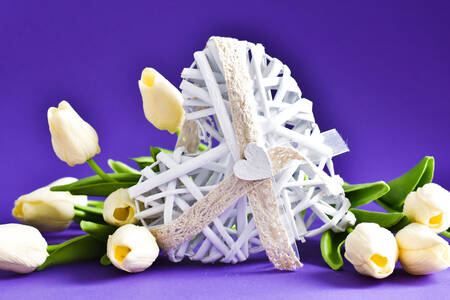 White heart and a bouquet of tulips